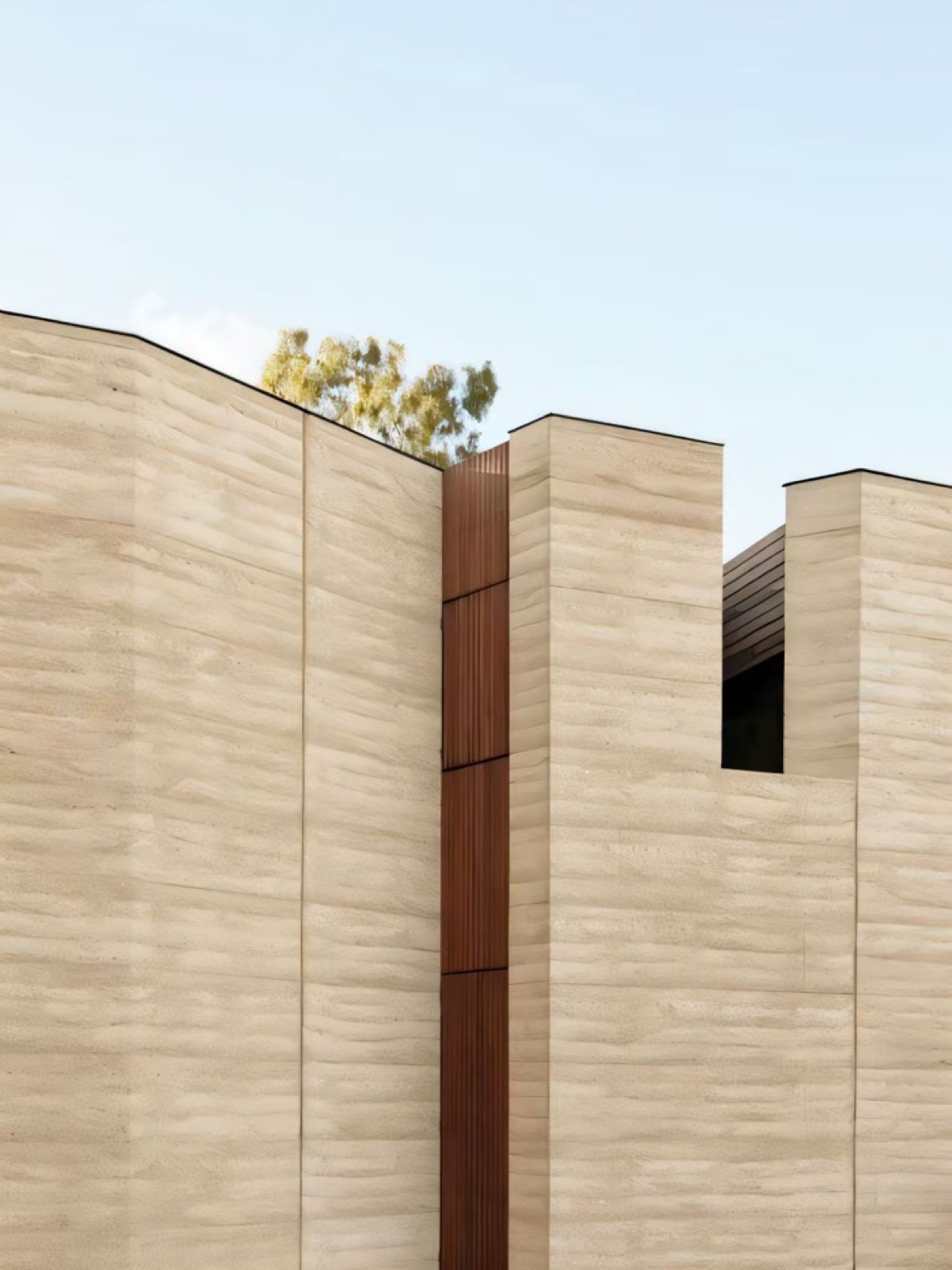 façade architecturale en pierre claire et bardage bois — ayyur interiors.